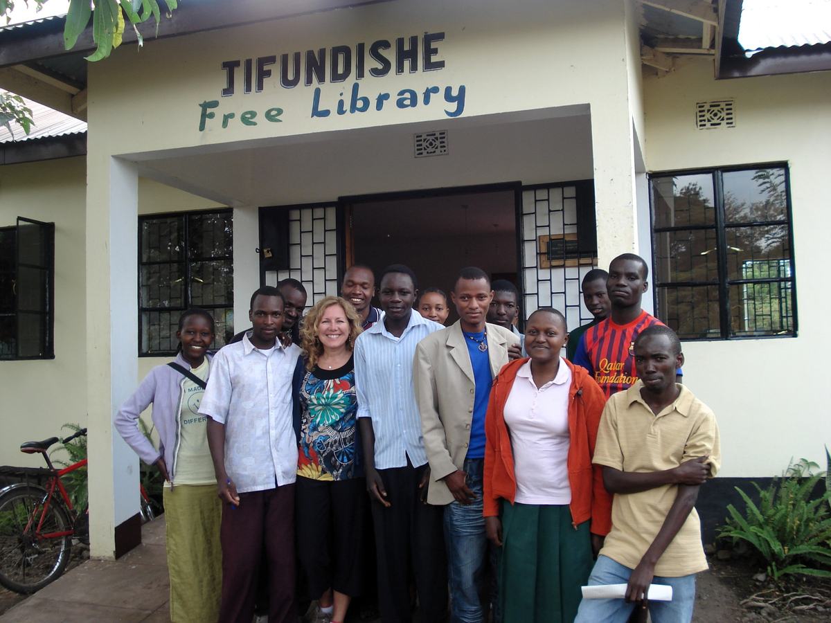 Mary Shandonay with a group of students at a library in Tanzania.
