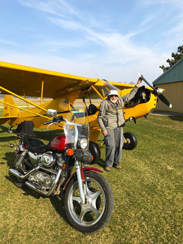Archie Henkelmann with Cub and Motorcycle