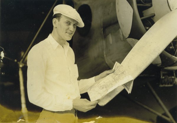 Clyde Lee with chart at front of Stinson ca unknown (Wittman Regional Airport)